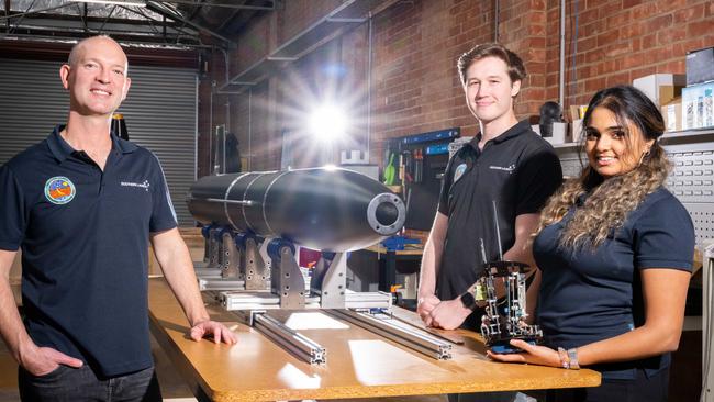 Southern Launch chief executive Lloyd Damp with graduate engineers Matthew Willson and Farisha Jamal at the company’s facility in Hindmarsh. Picture: NCA NewsWire/Morgan Sette