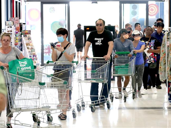 Shoppers queued at supermarkets across the state after Premier Steven Marshall announced new lockdown restrictions. Picture: Kelly Barnes/Getty Images