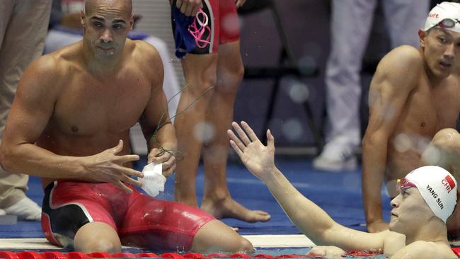 Sun Yang’s attempt at a handshake is snubbed by Brazil's Joao de Lucca. Picture: AP Photo/Mark Schiefelbein