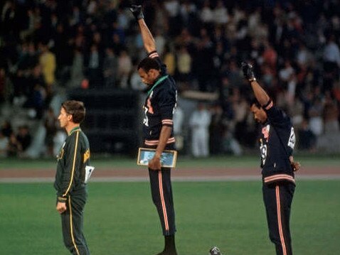 Peter Norman with Tommie Smith and John Carlos on the podium.