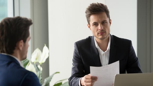 Distrustful businessman holding document at meeting, looking at partner with doubt suspicion, recruiter reads bad resume, caught applicant being dishonest at job interview, shady deal, contract fraud