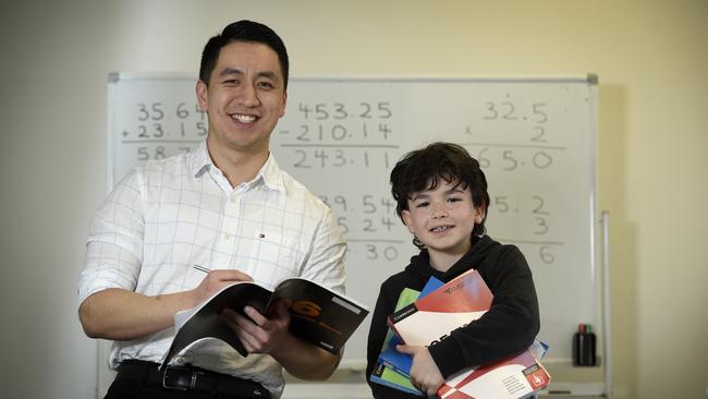 Ryan Ou, owner and tutor at Bayside Academics in Brighton, with student Jackson, 8. Picture: Andrew Henshaw