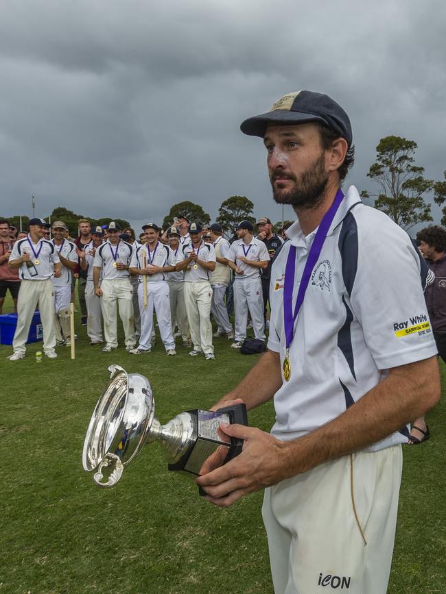 Kaine Smith with the 2015-16 MPCA District premiership trophy.