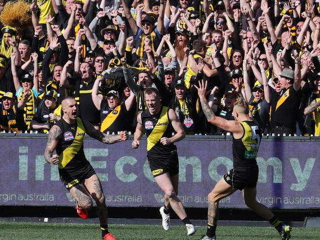 Dustin Martin, Jack Riewoldt and Brandon Ellis celebrate an early goal. Picture: Michael Klein.