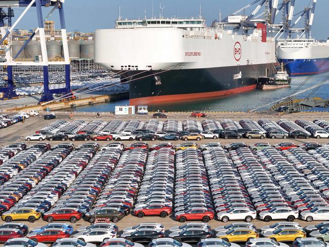 (FILES) The photo taken on January 10, 2024 shows electric cars for export waiting to be loaded on the "BYD Explorer NO.1", a domestically manufactured vessel intended to export Chinese automobiles, at Yantai port, in eastern China's Shandong province. The European Union said this week it would slap additional tariffs of up to 38 percent on Chinese electric car imports from next month after an anti-subsidy probe. (Photo by AFP) / China OUT