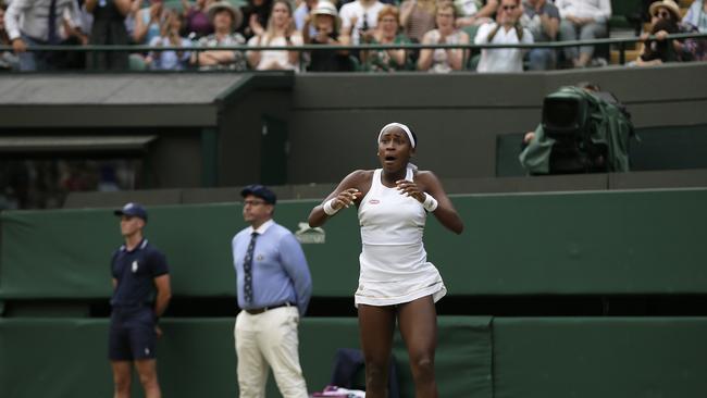 United States' Cori "Coco" Gauff reacts after beating United States's Venus Williams in a Women's singles match during day one of the Wimbledon Tennis Championships in London, Monday, July 1, 2019. (AP Photo/Tim Ireland)