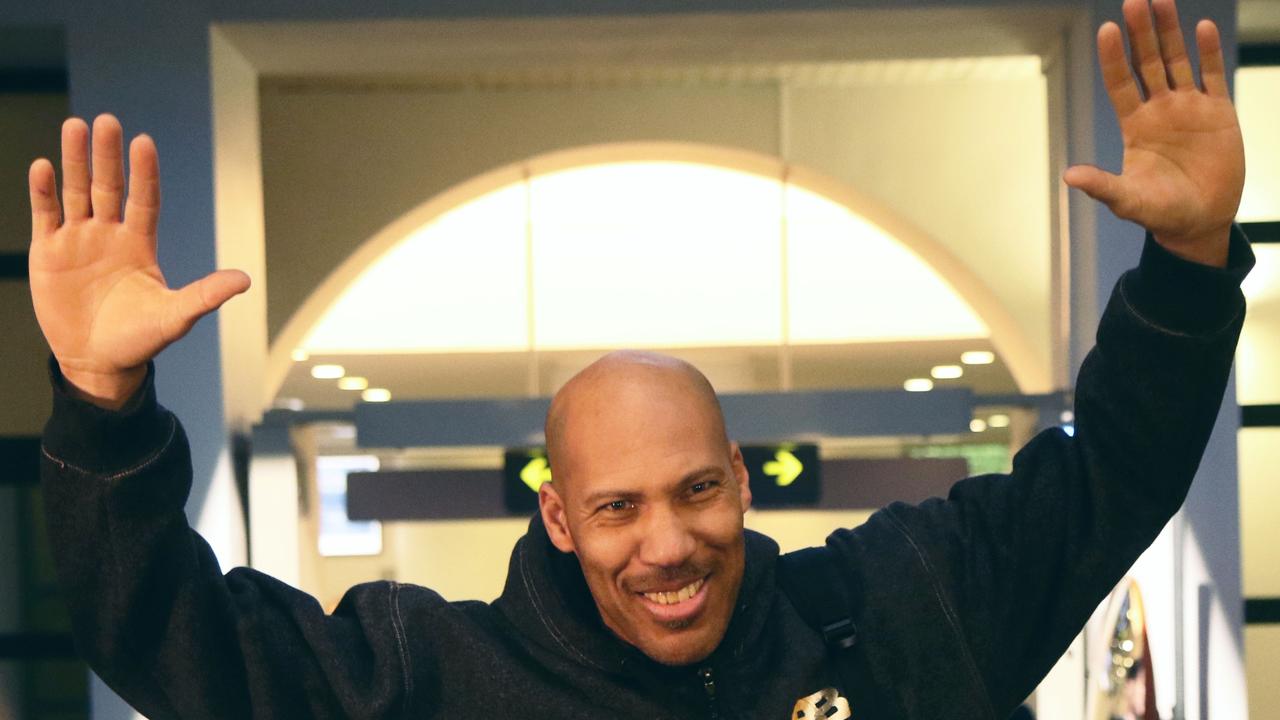 LaVar Ball waves upon his arrival with his sons at Vilnius airport in Lithuania.