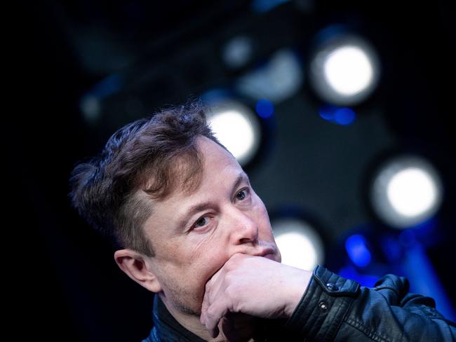 (FILES) In this file photo taken on March 09, 2020 Elon Musk, founder of SpaceX, listens to a question during the Satellite 2020 at the Washington Convention Center in Washington, DC. - Tesla, the global leader in electric cars, was excluded from the White House event August 4, 2021, where US President Joe Biden unveiled a big push for zero-emissions vehicles. "Yeah, seems odd that Tesla wasn't invited," Elon Musk tweeted about the event that featured legacy American carmakers General Motors, Ford and Chrysler's parent company Stellantis. (Photo by Brendan Smialowski / AFP)