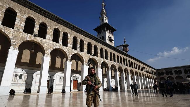 A rebel fighter in the Ummayad Mosque in Damascus. Picture; AFP.