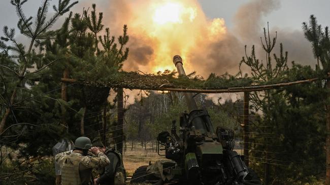 Ukrainian servicemen fire at Russian positions on Monday. Picture: AFP