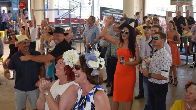 A small but boisterous crowd roar on Vow and Declare to the tight win at the Gympie Turf Club on Melbourne Cup Day last year.