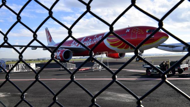 Air Asia flight D7207 sits on the tarmac at Brisbane Airport in Brisbane, Tuesday, July 4. Photo: AAP Image/Darren England