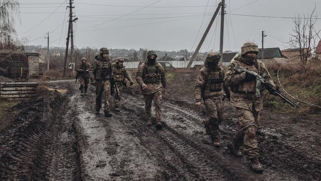 Ukrainian soldiers walk to the frontline in Bakhmut. Picture: Getty Images