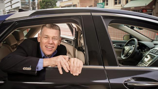 Cohda Wireless CEO Paul Gray tests out a driverless car in Adelaide. Photo: AAP/MIKE BURTON