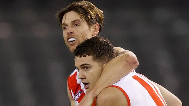 MELBOURNE, AUSTRALIA - AUGUST 14: Dane Rampe (L) and Tom Papley of the Swans celebrate during the 2021 AFL Round 22 match between the North Melbourne Kangaroos and the Sydney Swans at Marvel Stadium on August 14, 2021 in Melbourne, Australia. (Photo by Michael Willson/AFL Photos via Getty Images)