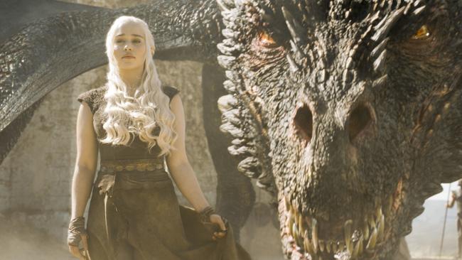 Daenerys Targaryen (played by Emilia Clarke) with one of her dragons in a scene from Game of Thrones season 6, episode 9