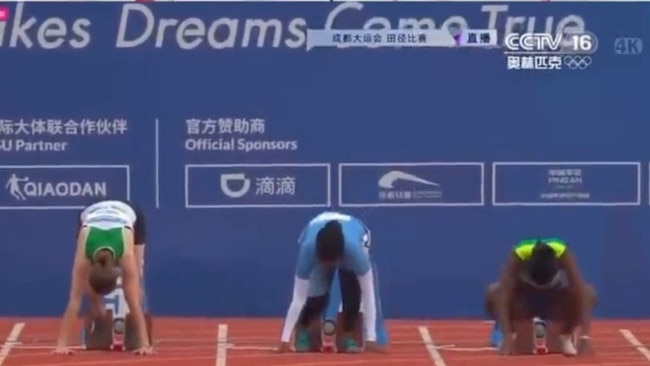 Nasra Ali Abukar prepares for the women’s 100m heat to start. Photo: Twitter.
