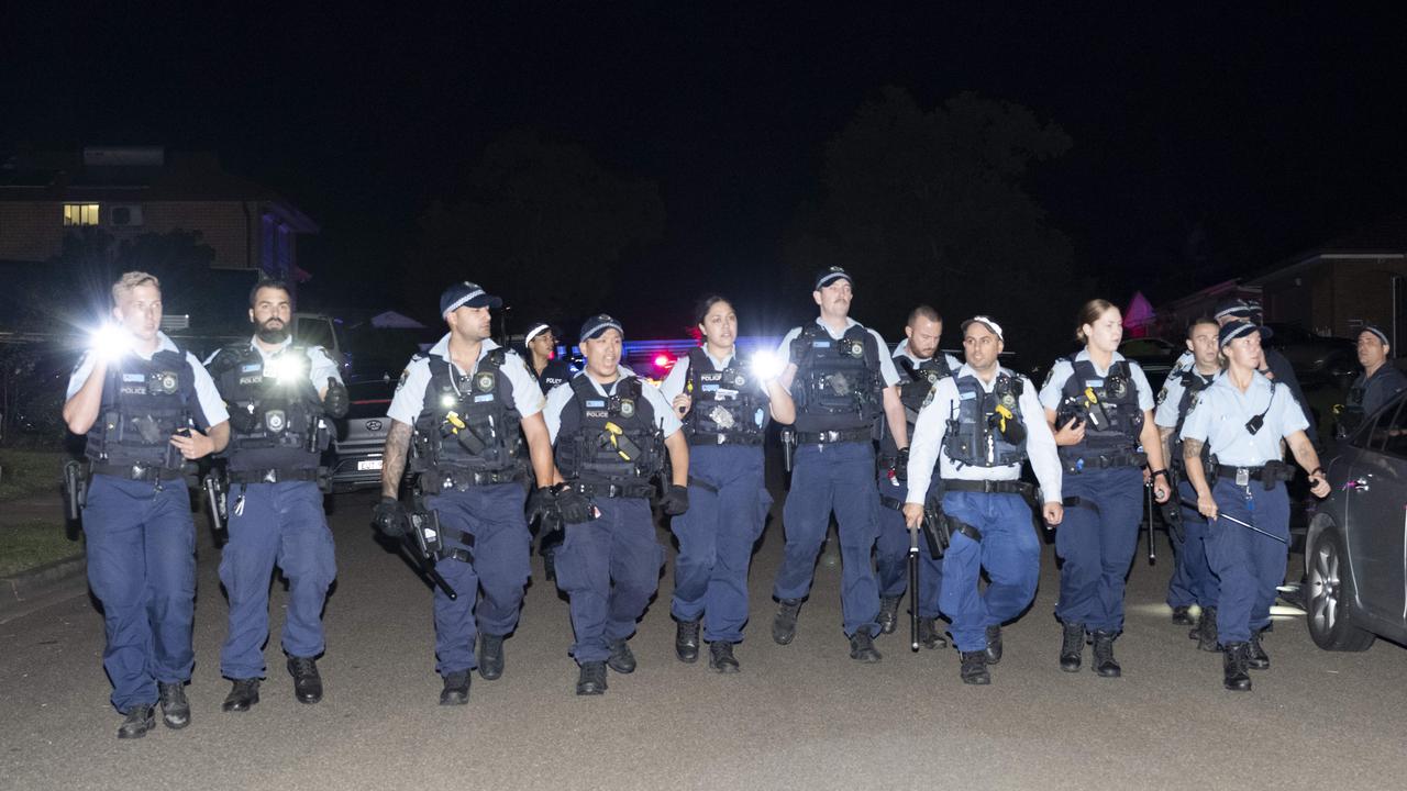 Pandemonium has erupted in Sydneys west with an angry mob of 2,000 people surrounding a church and attacking police after a popular Christian leader was stabbed during a live streamed service. Picture: NCA NewsWire / Monique Harmer