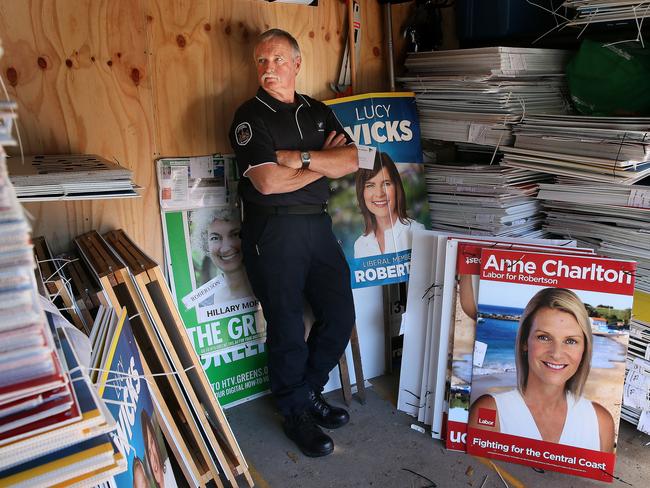 Central Coast Council Ranger Bill Eggins stacks over 700 confiscated political signs. Picture: Troy Snook