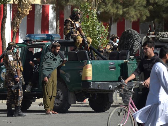 Taliban members keep watch near the site where a grenade was thrown at a Taliban vehicle at the Deh Mazang Circle in Kabul on October 20, 2021. Picture: Wakil Kohsar / AFP