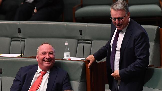 Fitzgibbon shares a laugh with the Member for New England Barnaby Joyce during Question Time.