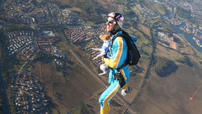 Archie Jamieson from Gold Coast Skydive, with his pet dog, who doesn’t mind the occassional skydive. Photo: Gold Coast Skydive