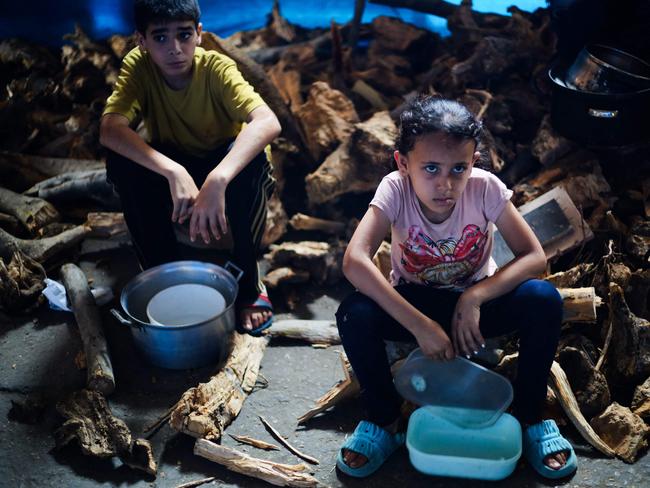 Palestinian children wait for food at a distribution point in Nuseirat, central Gaza Strip. Picture: AFP
