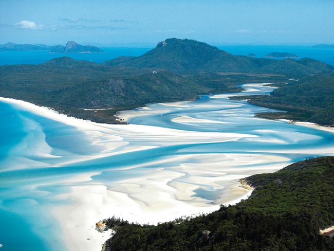 Shallow clear water at Whitsunday Island's beach create marble like Hill Inlets. For: Cook Tour. Picture: Tourism and Events Queensland