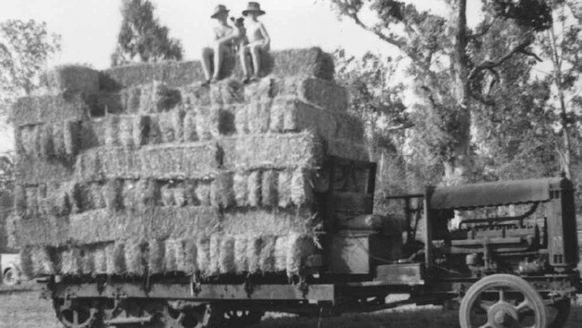 John and Eric Scott in the mid 1950s sitting atop a load of hay on the same Linn tractor that they still use on the farm today. Picture: Contributed