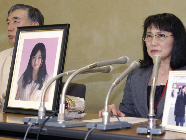 In this Oct. 7, 2016 photo, Yukimi Takahashi, right, mother of Matsuri, with lawyer Hiroshi Kawahito, speaks to journalists at a news conference in Tokyo after her daughter's suicide was recognized as â€œkaroshi,â€ or death from overwork. Matsuri Takahashiâ€™s dream career at Japanâ€™s top ad agency, Dentsu, ended with her suicide after her overtime exceeded 100 hours a month. (Kyodo News via AP)