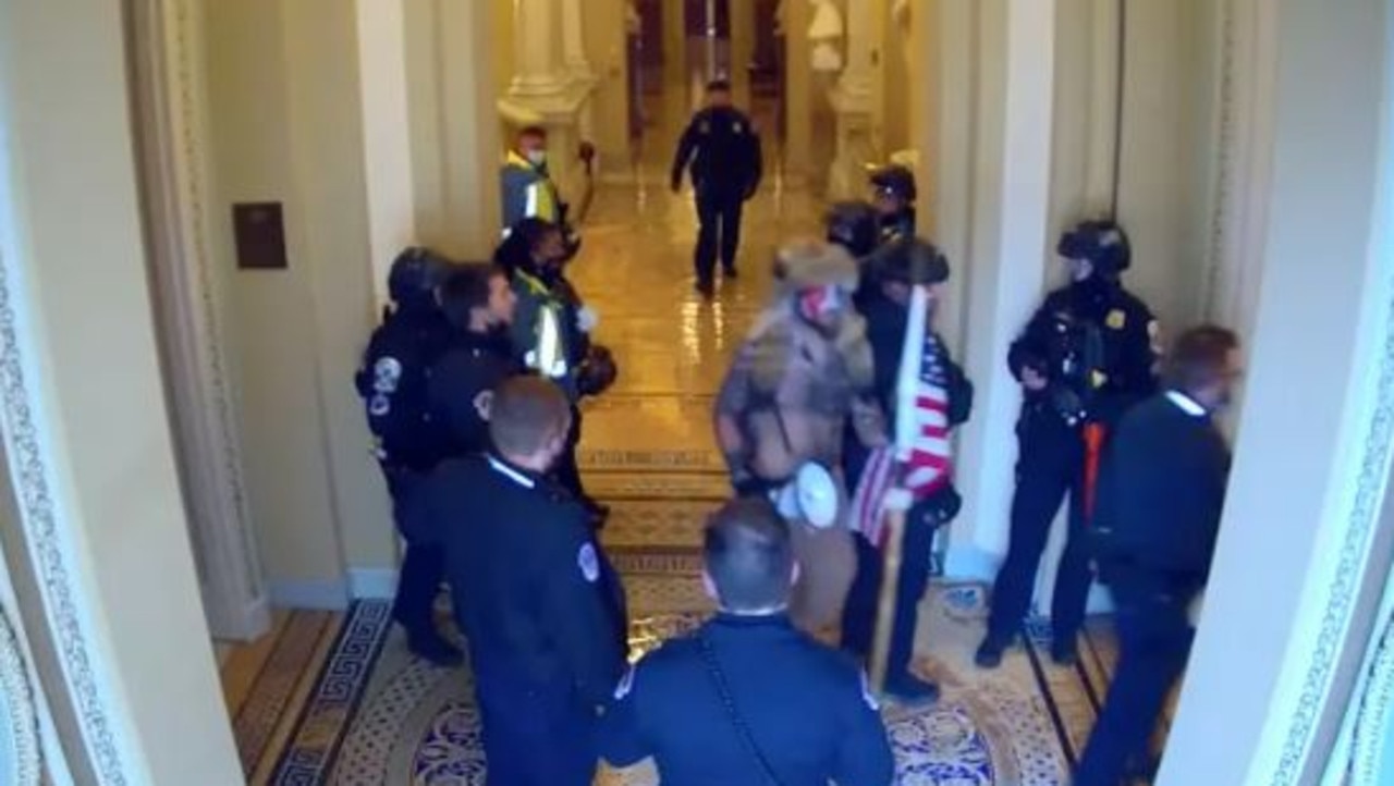 January 6 Footage Shows Capitol Cops Escorting QAnon Shaman To Senate ...