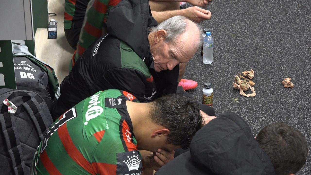 Latrell Mitchell receives support from Bunnies teammates and coach Wayne Bennett