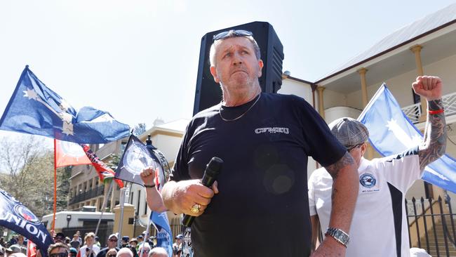 Darren Greenfield addresses a crowd of thousands of striking workers. Picture: Max Mason-Hubers