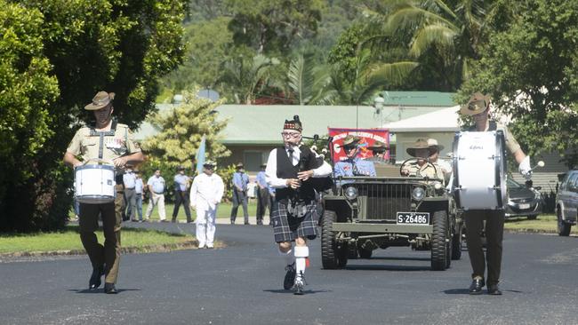 Piper Judith Tannock and drummers from 1RAR lead the parade at the 77th anniversary commemorations of the Battle of the Coral Sea at Cardwell yesterday. PIC: CHRIS HOLMES