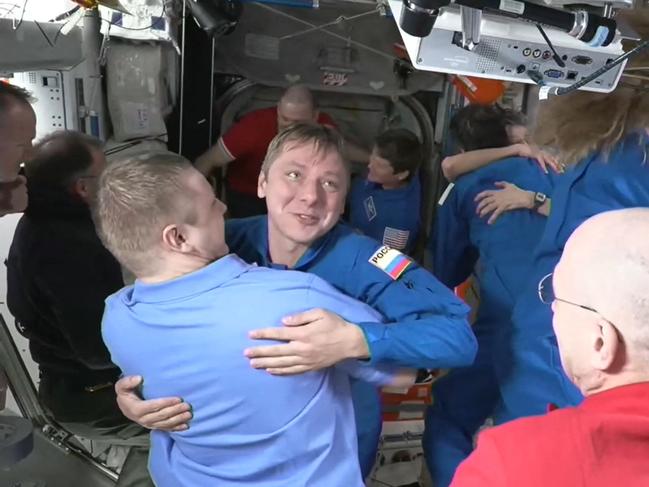 Roscosmos cosmonaut Kirill Peskov greeting members of the International Space Station crew shortly after docking at the ISS. Picture: NASA / AFP