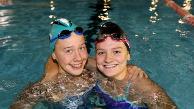 Best friends Emma Siddle and Chelsea Hodges, who swim together at Southport Olympic Swim Club, will compete at the Junior Pan Pacs Fiji in next month. Picture: Mike Batterham