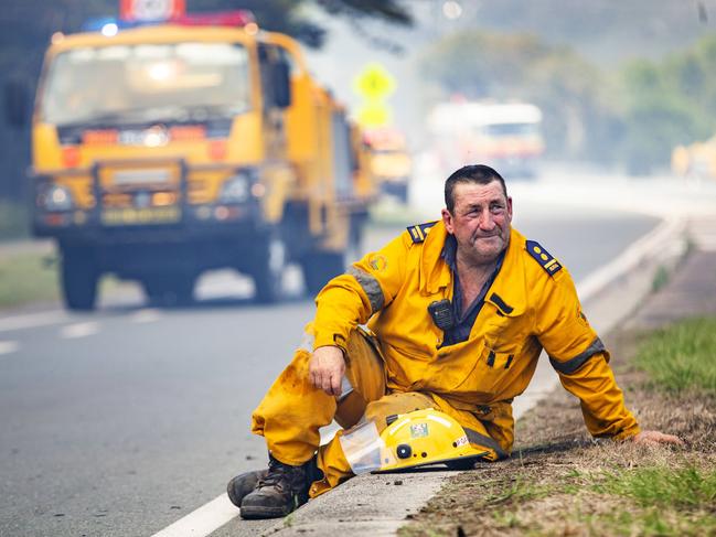 Rural firefighters stop to catch their breath during Queensland’s bushfire crisis. Picture: Lachie Millard
