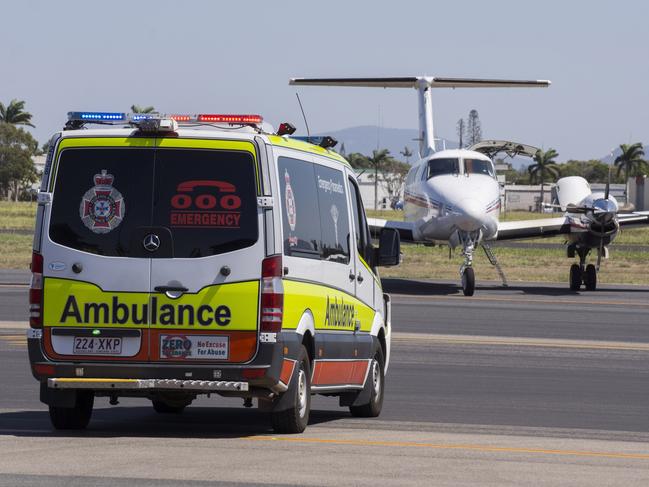 A 12-year-old Melbourne girl attacked by a shark in Cid Harbour yesterday arrives at Mackay Airport for transfer to Brisbane. Picture: Daryl Wright