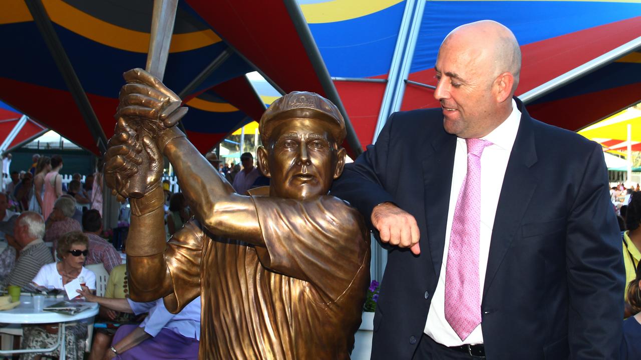 Darren Lehmann poses alongside the bronze statue of him at Adelaide Oval in 2012. Picture: Ben Macmahon (AAP)