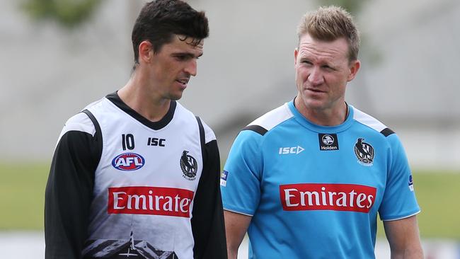 Scott Pendlebury and coach Nathan Buckley at Collingwood training on Monday morning. De Goey didn’t train with his teammates. Picture: David Crosling