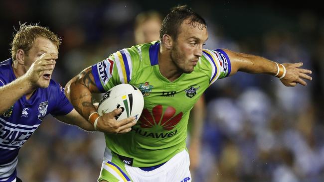 Canberra's Josh Hodgson breaks clear of Bulldogs Joshua Jackson during NRL match Canterbury Bulldogs v Canberra Raiders at Belmore Sports Ground. Picture. Phil Hillyard