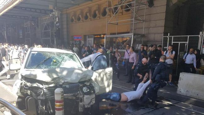 AT LEAST 12 pedestrians have been struck by an out-of-control car on Flinders St between Elizabeth and Swanston streets in the heart of Melbourne this afternoon. The driver of the car has been arrested by police. Commuters were making their way to and from the city’s main train station around 4.40pm when the white SUV collided with pedestrians. Source Ch7