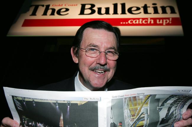 JULY 26, 2004: Gary Baildon at the opening of the new building reading the Bulletin hot off the press. PicAnn-Louise Hovey - The Gold Coast Bulletin Picture: Louise Hovey Ann