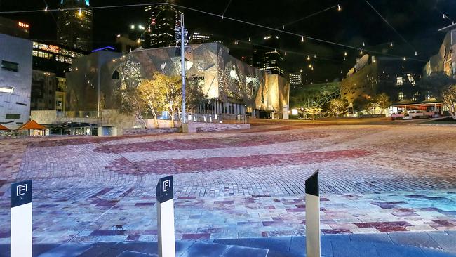 Melbourne’s CBD lies empty on a Friday night during the coronavirus pandemic. Picture: Ian Currie