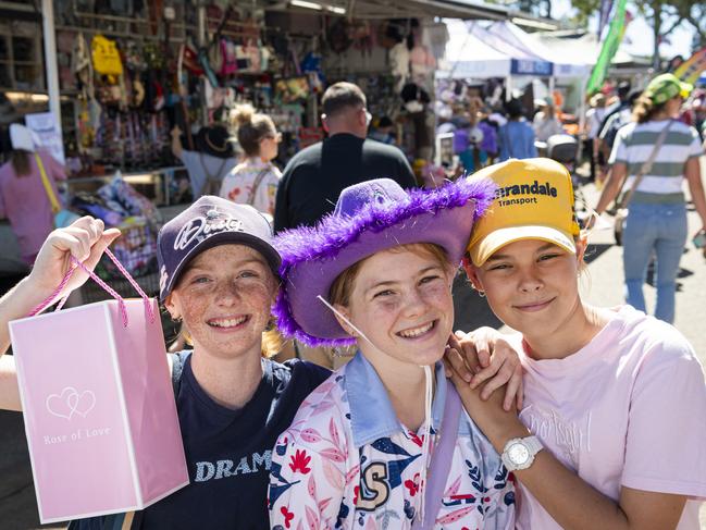 Fairholme College year 7 boarders (from left) Chelsey Crump, Ruby Lucht and Grace Miller having fun at the Toowoomba Royal Show, Friday, April 19, 2024. Picture: Kevin Farmer