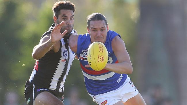 Lukas Webb battles Daniel Wells for the ball. Picture: Michael Klein