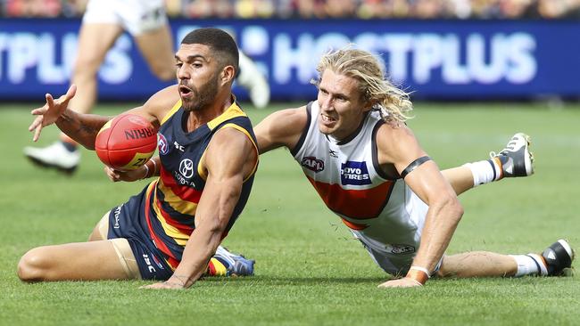 Adelaide’s Curtly Hampton gains possession against GWS Giants’ Nick Haynes.