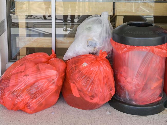 ADELAIDE, AUSTRALIA - NewsWire Photos NOVEMBER 9, 2022: Plastic bags below a notice in Coles at Park Holme in AdelaideÃs south saying soft plastic bags will no longer be recycled . Picture: NCA NewsWire / Brenton Edwards