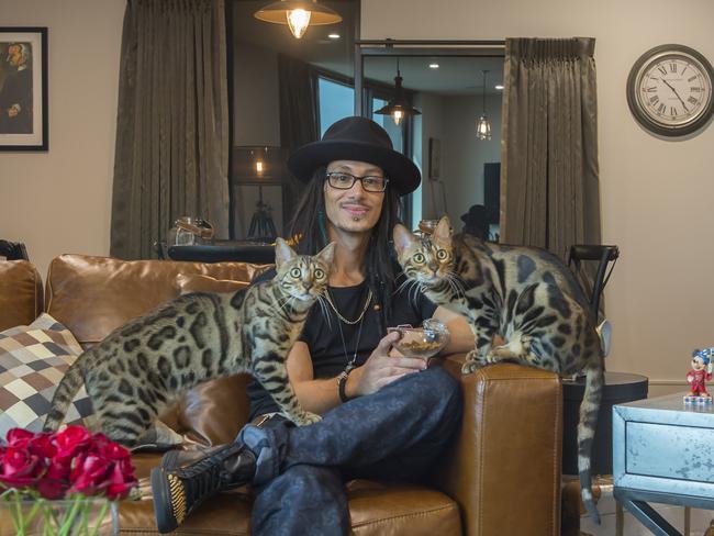 Cosentino with his favourite things ... his Bengal cats.