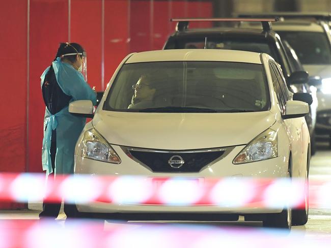 Healthcare employees in a COVID-19 testing facility at Northland shopping centre. Picture: AAP.